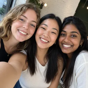 A group selfie of three friends of different ethnic backgrounds smiling at the camera. - OpenAI GPT Image 2