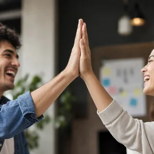 Two people high-fiving, with focus on their hands meeting mid-air. - OpenAI GPT Image 2