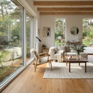 A photorealistic interior of a modern Scandinavian-style living room with natural light streaming through floor-to-ceiling windows. Show detailed wood textures, fabric materials, and proper light reflections. - Google Nano Banana 2 Lite