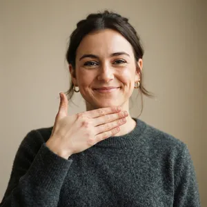 Photorealistic close-up portrait of a person clearly performing the American Sign Language gesture for 