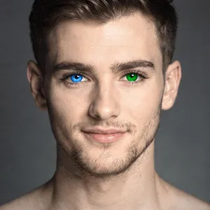 A studio headshot of a young man with one blue eye and one green eye (heterochromia). - Black Forest Labs Flux 2 Pro