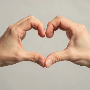 Two hands forming a heart shape together against a plain background. - Black Forest Labs Flux 2 Pro