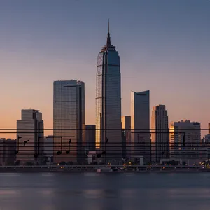 A city skyline that forms the shape of musical notes on a staff, created in a stylized graphic design aesthetic with clean architectural lines and dramatic twilight colors. - Alibaba Z-Image Turbo