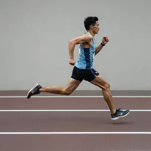 A runner mid-stride in a full-body action shot, limbs in motion and well-defined. - Alibaba Z-Image Turbo