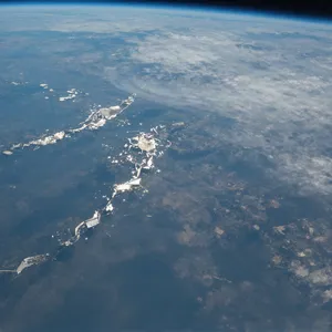 Photorealistic aerial photograph clearly showing the edge of the Earth from space, capturing realistic curvature, atmosphere, and sunlight reflections - Alibaba Z-Image Turbo
