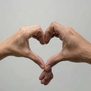 Two hands forming a heart shape together against a plain background. - Alibaba Z-Image Turbo