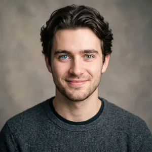 A studio headshot of a young man with one blue eye and one green eye (heterochromia). - Google Nano Banana 2