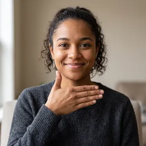 Photorealistic close-up portrait of a person clearly performing the American Sign Language gesture for 