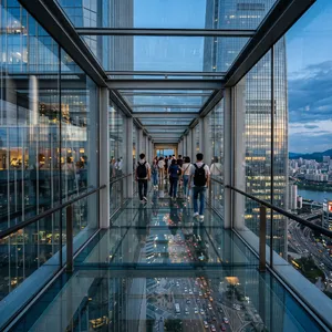 Photorealistic rendering of a contemporary glass skybridge between two skyscrapers, seen from inside with city views visible through glass walls and floor. Show accurate reflections and structural details. - Google Nano Banana 2