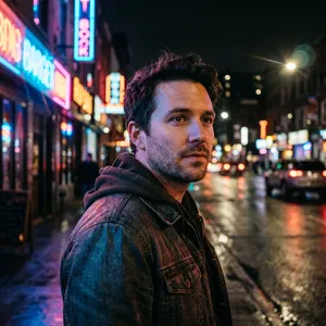 A nighttime portrait of a man lit by neon signs on a city street. - Google Nano Banana 2.1