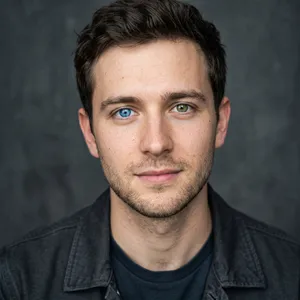 A studio headshot of a young man with one blue eye and one green eye (heterochromia). - Google Nano Banana 2.1