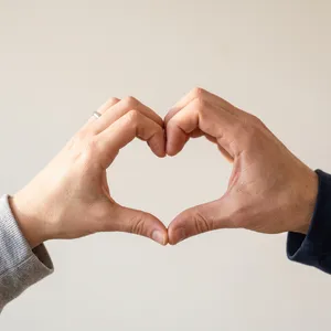 Two hands forming a heart shape together against a plain background. - Google Nano Banana 2.1