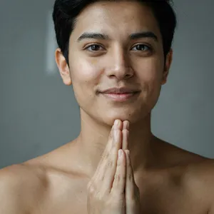 Photorealistic close-up portrait of a person clearly performing the American Sign Language gesture for 