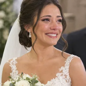 A bride on her wedding day, smiling with tears of joy in her eyes. - OpenAI GPT Image 2.5 Flare