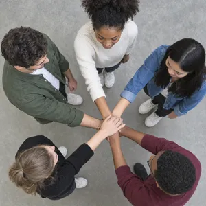 A group of five people joining hands in a circle, seen from above. - OpenAI GPT Image 2.5 Flare