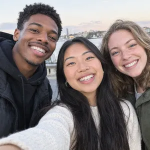 A group selfie of three friends of different ethnic backgrounds smiling at the camera. - OpenAI GPT Image 2.5 Flare