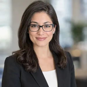 A professional headshot of a businesswoman wearing glasses, against a blurred background. - OpenAI GPT Image 2.5 Flare