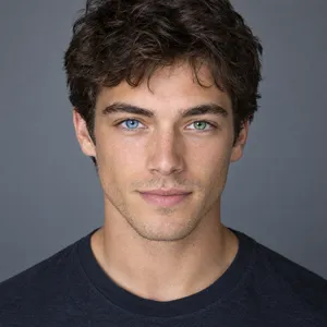 A studio headshot of a young man with one blue eye and one green eye (heterochromia). - OpenAI GPT Image 2.5 Flare