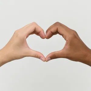 Two hands forming a heart shape together against a plain background. - OpenAI GPT Image 2.5 Flare