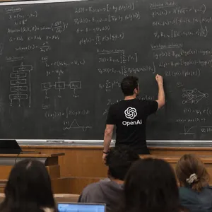 Photorealistic depiction of a man wearing a clearly visible black OpenAI-branded T-shirt. He is standing at the front of a university lecture hall, writing complex mathematics and AI-related equations across a large, dusty chalkboard filled with notation - OpenAI GPT Image 2.5 Sunburst