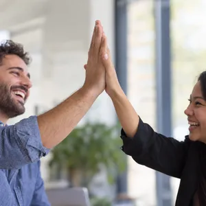 Two people high-fiving, with focus on their hands meeting mid-air. - OpenAI GPT Image 2.5 Sunburst