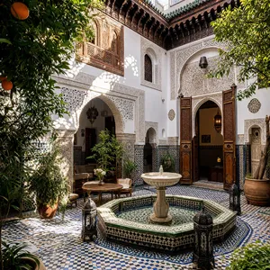 A traditional Moroccan riad courtyard with detailed zellige tilework, flowing fountain, citrus trees, and ornate woodwork. Morning light casting intricate shadow patterns. - OpenAI GPT Image 2
