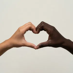 Two hands forming a heart shape together against a plain background. - XAI Grok Imagine