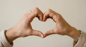 Two hands forming a heart shape together against a plain background. - Google Nano Banana 2