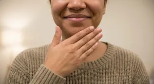 Photorealistic close-up portrait of a person clearly performing the American Sign Language gesture for 