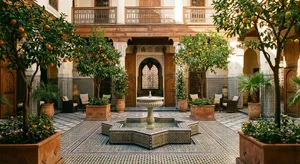 A traditional Moroccan riad courtyard with detailed zellige tilework, flowing fountain, citrus trees, and ornate woodwork. Morning light casting intricate shadow patterns. - Google Nano Banana Pro