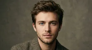 A studio headshot of a young man with one blue eye and one green eye (heterochromia). - Google Nano Banana Pro