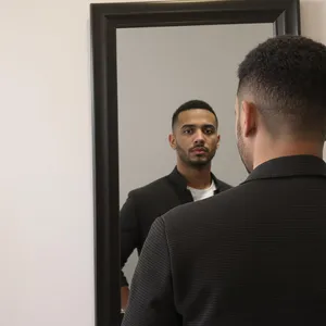 A person standing before a mirror, with their front and reflected back both visible. - Black Forest Labs Flux 1.1 Pro Ultra