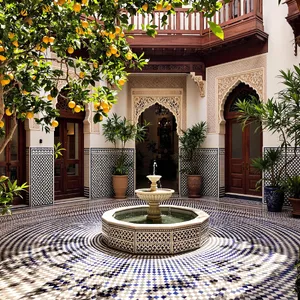 A traditional Moroccan riad courtyard with detailed zellige tilework, flowing fountain, citrus trees, and ornate woodwork. Morning light casting intricate shadow patterns. - Black Forest Labs Flux 1.1 Pro Ultra