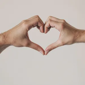 Two hands forming a heart shape together against a plain background. - Black Forest Labs Flux 1.1 Pro Ultra