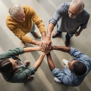 A group of five people joining hands in a circle, seen from above. - Black Forest Labs Flux 2 Pro