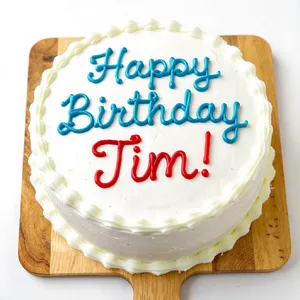 A birthday cake with icing that spells 
