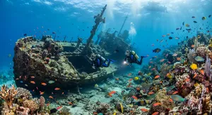 An underwater scene with scuba divers exploring a coral reef alongside colorful fish and a sunken ship. - Google Nano Banana 2 Lite