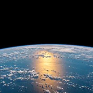 Photorealistic aerial photograph clearly showing the edge of the Earth from space, capturing realistic curvature, atmosphere, and sunlight reflections - Google Imagen 3.0