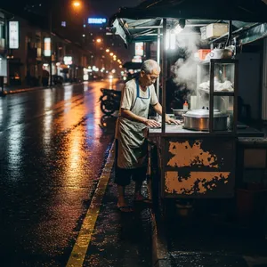 Rain-slicked Singapore street, 3 AM. A lone elderly hawker cleans his cart under one flickering fluorescent light. Steam rises gently. Low-angle shot, photorealistic - Google Imagen 4.0 Ultra