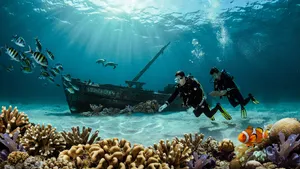 An underwater scene with scuba divers exploring a coral reef alongside colorful fish and a sunken ship. - Ideogram Ideogram 4.0 (Quality)