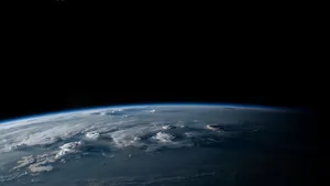 Photorealistic aerial photograph clearly showing the edge of the Earth from space, capturing realistic curvature, atmosphere, and sunlight reflections - Ideogram Ideogram 4.0 (Quality)