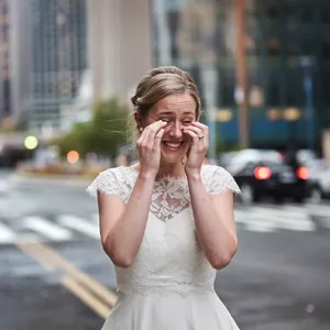 A bride on her wedding day, smiling with tears of joy in her eyes. - Ideogram Ideogram V2