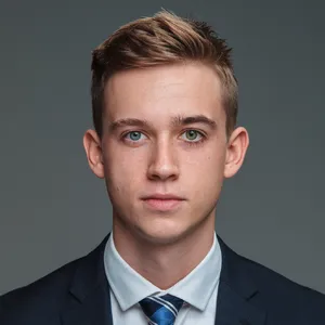 A studio headshot of a young man with one blue eye and one green eye (heterochromia). - Ideogram Ideogram V2