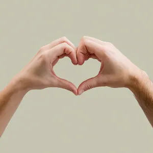 Two hands forming a heart shape together against a plain background. - Ideogram Ideogram V2