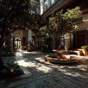 A traditional Moroccan riad courtyard with detailed zellige tilework, flowing fountain, citrus trees, and ornate woodwork. Morning light casting intricate shadow patterns. - Midjourney Midjourney v7