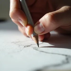 A hand drawing a sketch on paper with a pencil, the hand and pencil tip in clear focus. - Minimax MiniMax Image-01