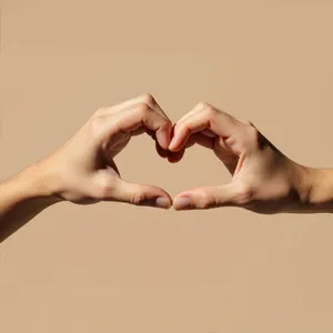 Two hands forming a heart shape together against a plain background. - Minimax MiniMax Image-01