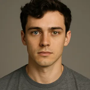 A studio headshot of a young man with one blue eye and one green eye (heterochromia). - OpenAI ChatGPT 4o