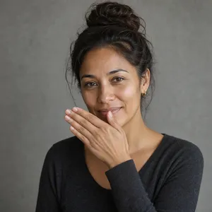 Photorealistic close-up portrait of a person clearly performing the American Sign Language gesture for 