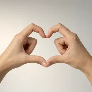 Two hands forming a heart shape together against a plain background. - Alibaba Qwen-Image-3.0-Pro
